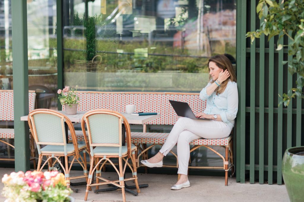 Sanna Koritz on Laptop Outside Cafe